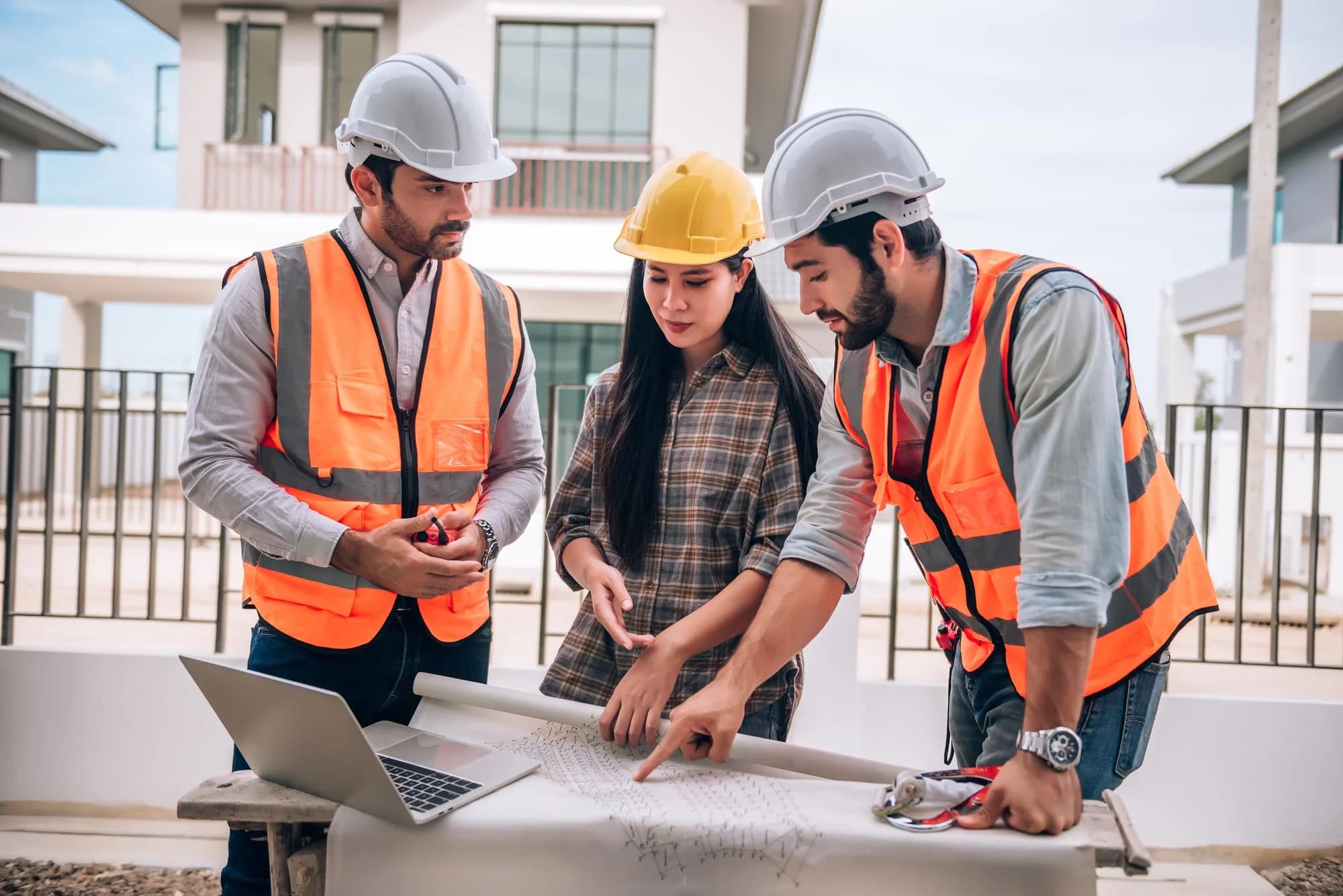 Architects working together at a construction site.