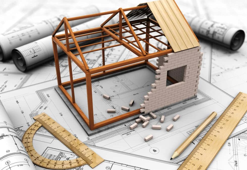 A 3D illustration showing a small model of a house under construction.