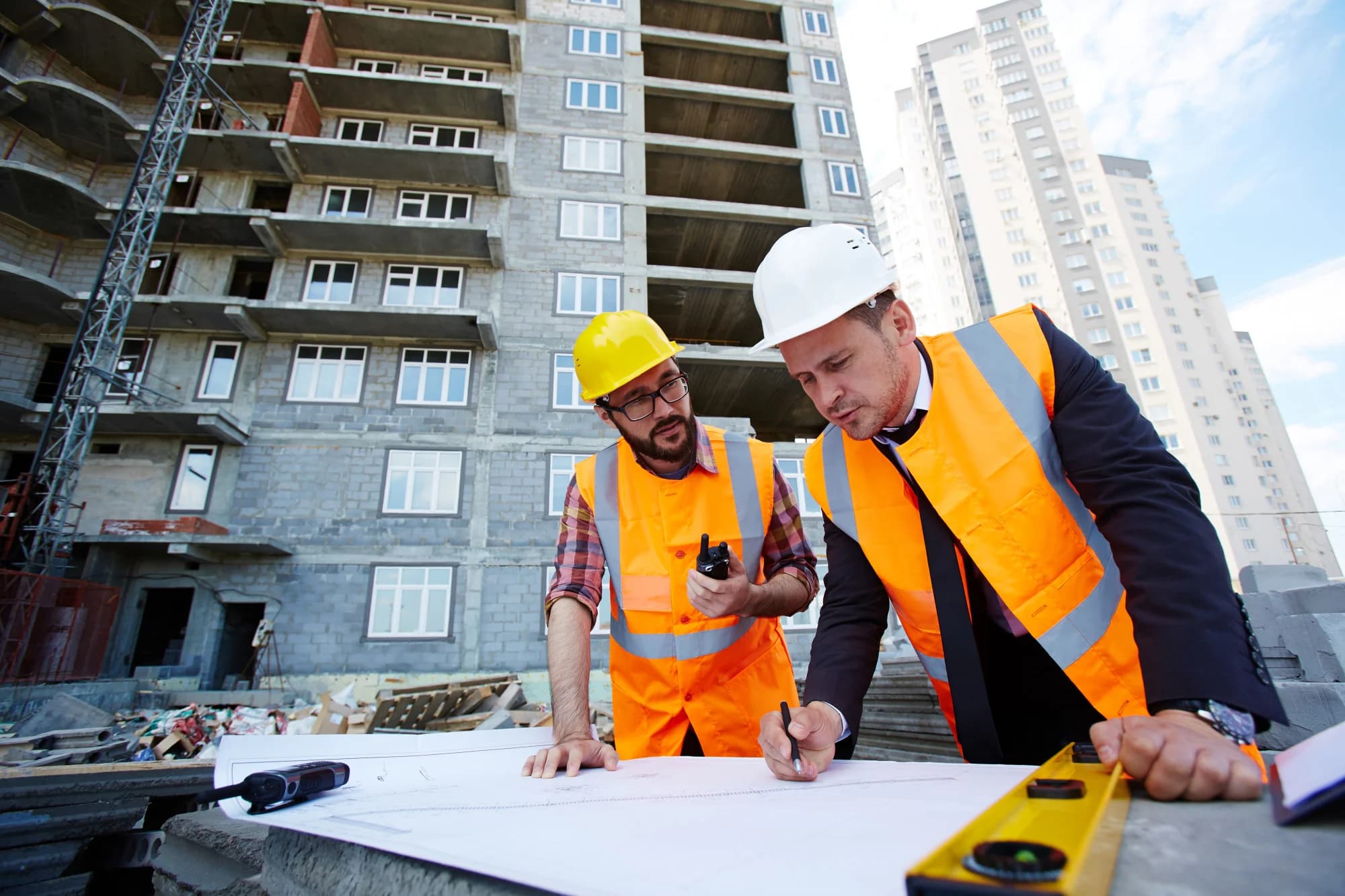 Construction professionals collaborating on a project site.